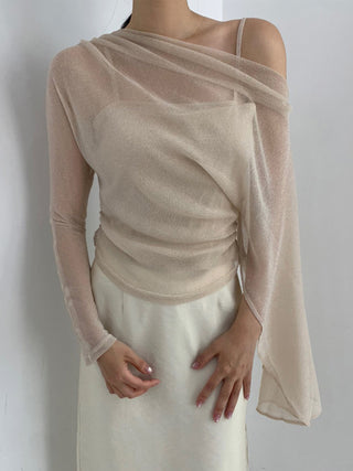 Model wearing an ivory draped off-shoulder sheer-look long-sleeve top