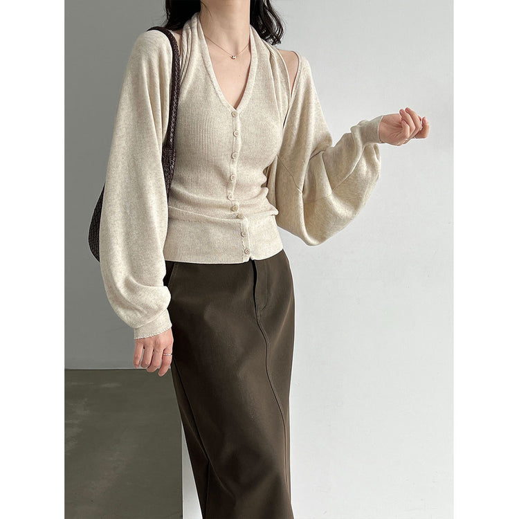 Cream two-piece knit cardigan and sleeveless vest set with V-neck button-front detail.