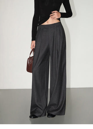 Charcoal pinstripe wide-leg trousers with front pleats, full-length view on model