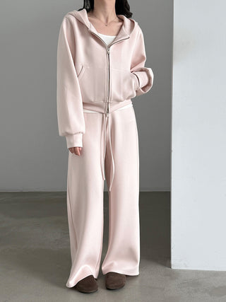 Pale pink matching hoodie and pants showing front zipper and drawstring waist