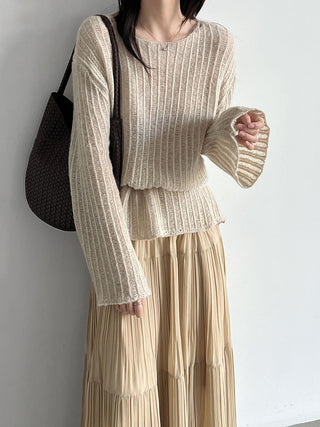 Beige textured knit top with long flared sleeves, styled with a pleated skirt; skirt not included.
