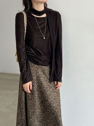 Black scarf-neck long-sleeve top worn with a patterned skirt; skirt is not included.