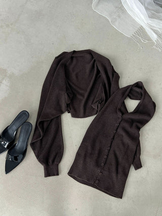 Cream two-piece knit cardigan and V-neck vest set styled with a dark skirt; skirt is not included.