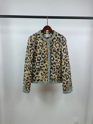 Hanging front view of collarless leopard jacket with contrast trim