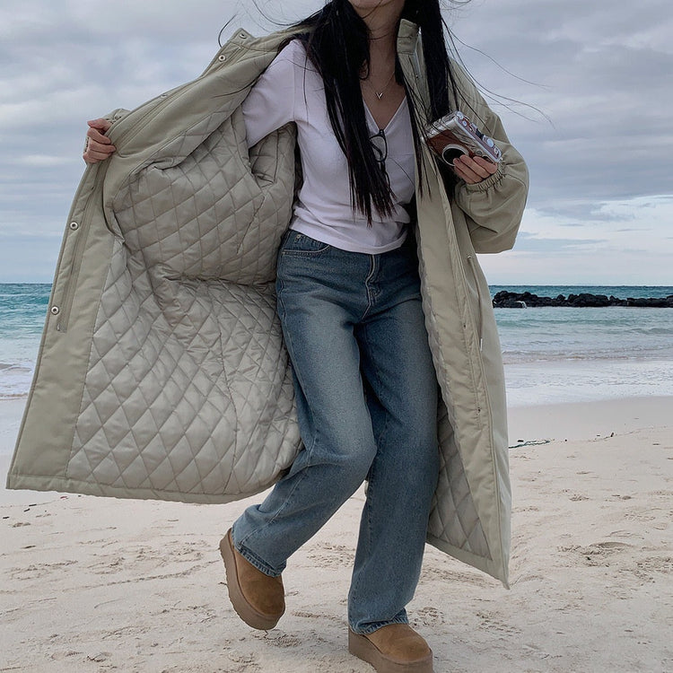 Light khaki parka opened to show diamond-quilted interior lining