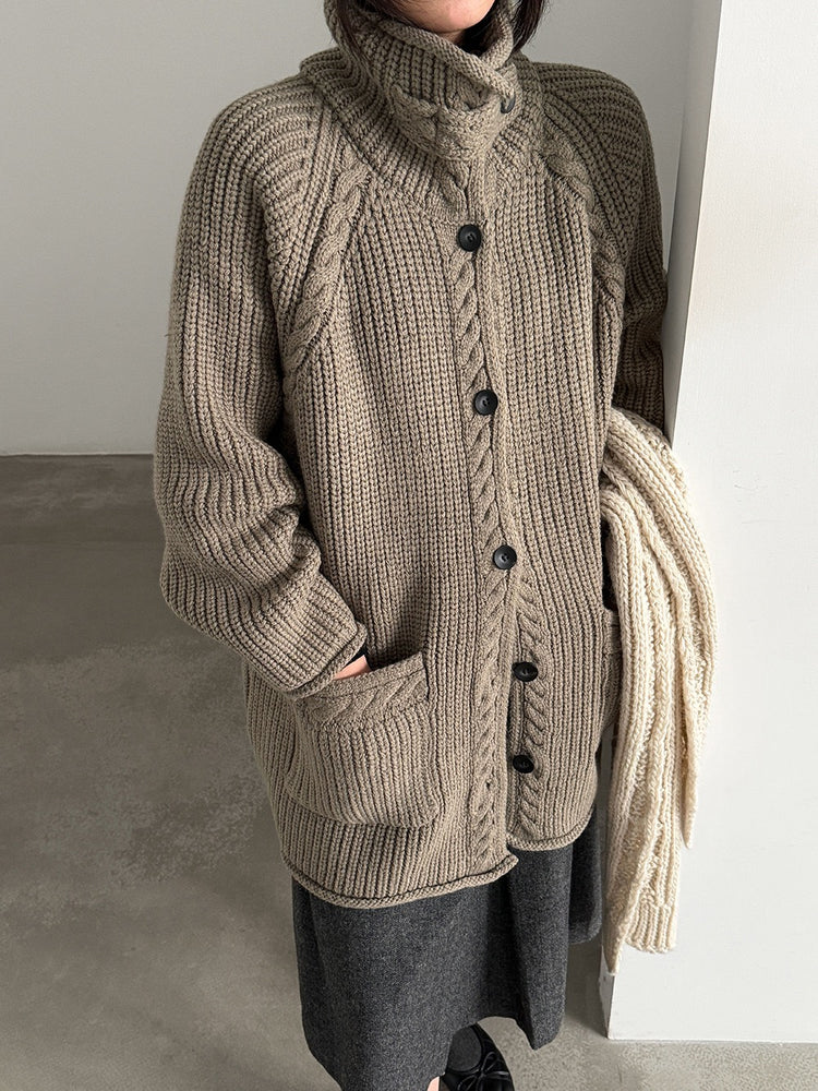 Taupe cardigan with cable-knit trim and front patch pockets
