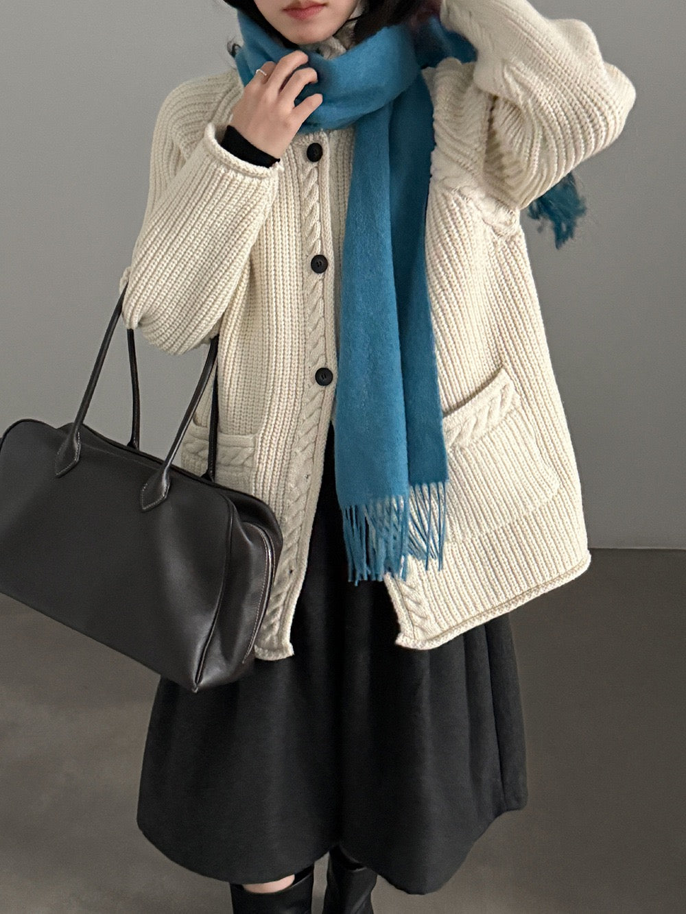 Ivory cardigan styled with a blue scarf, scarf not included