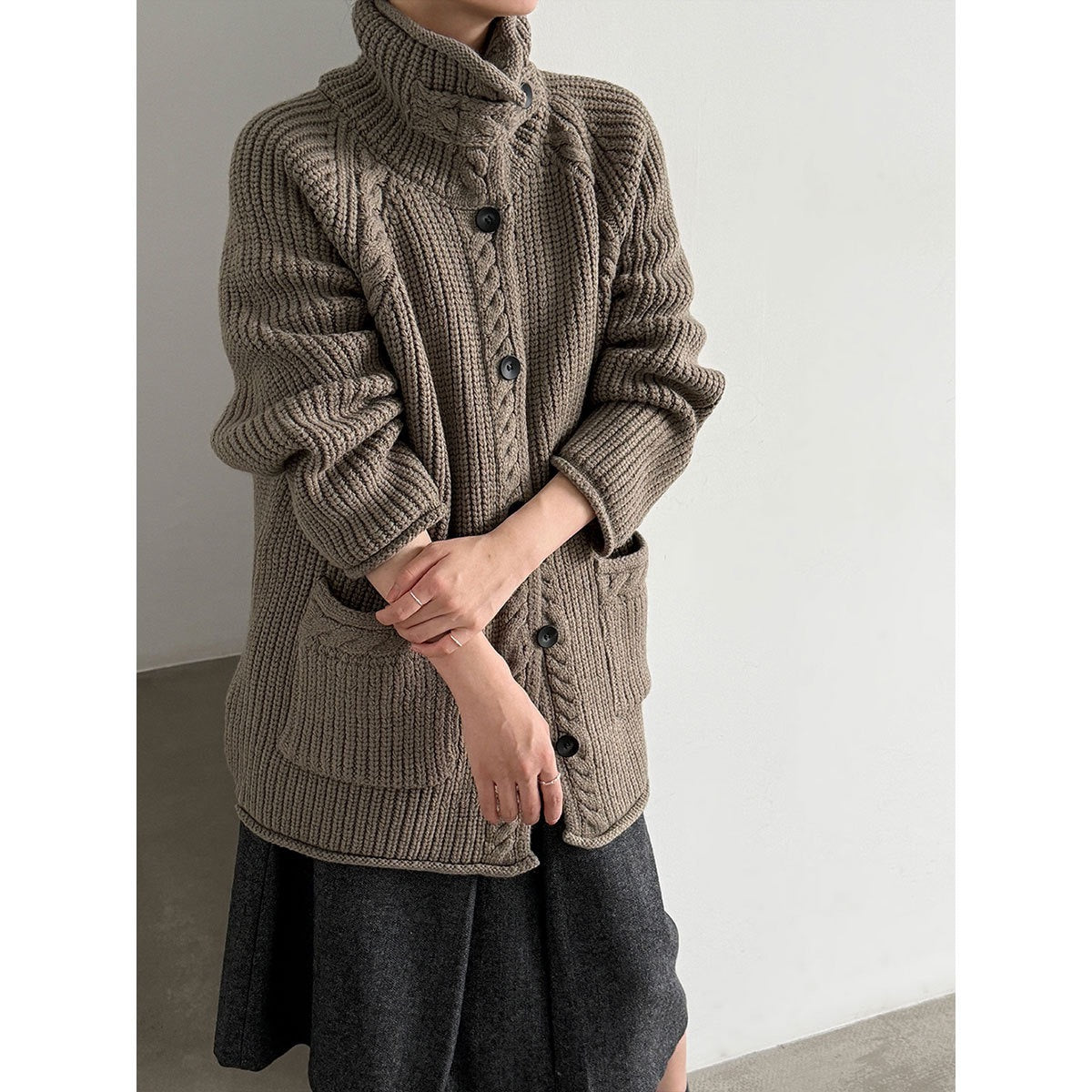 Taupe high-neck cable knit cardigan, front view