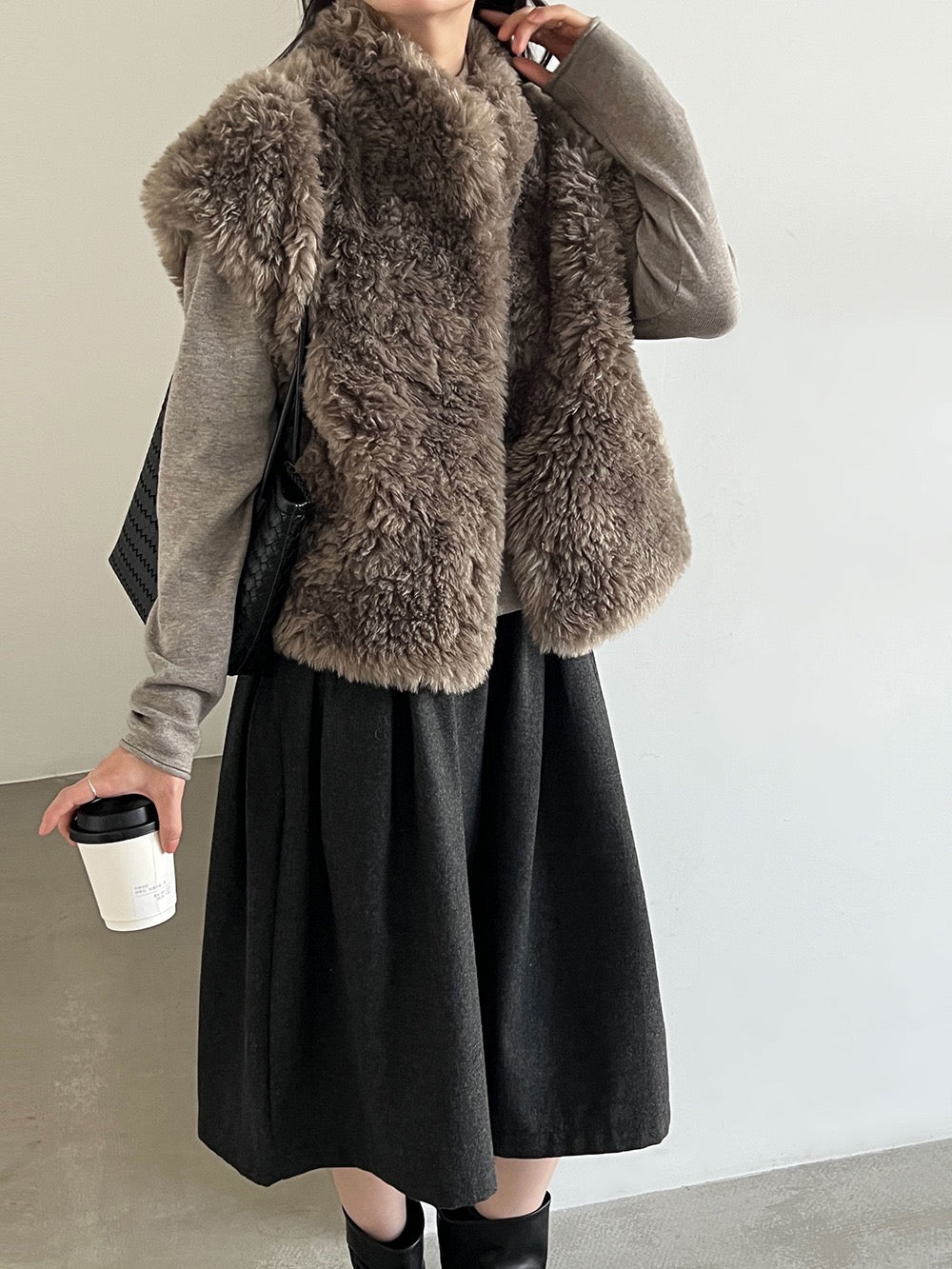 Taupe curly-textured vest, angled view